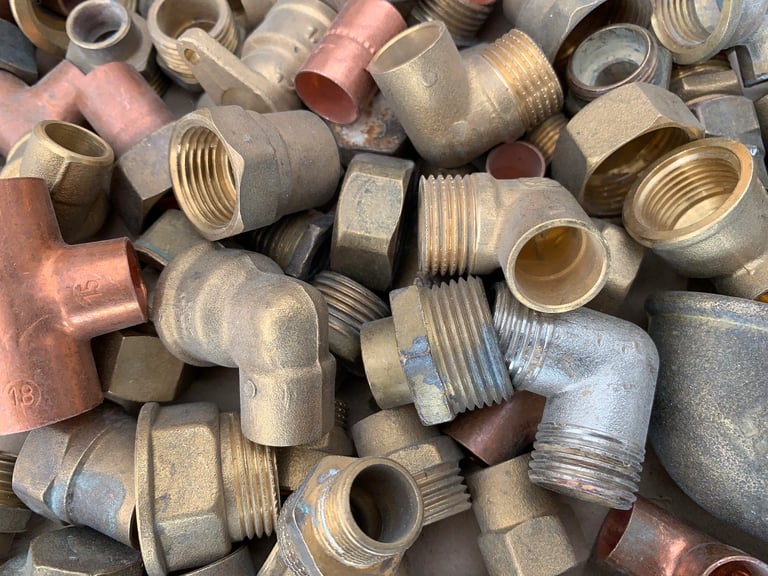 Copper and brass plumbing pieces