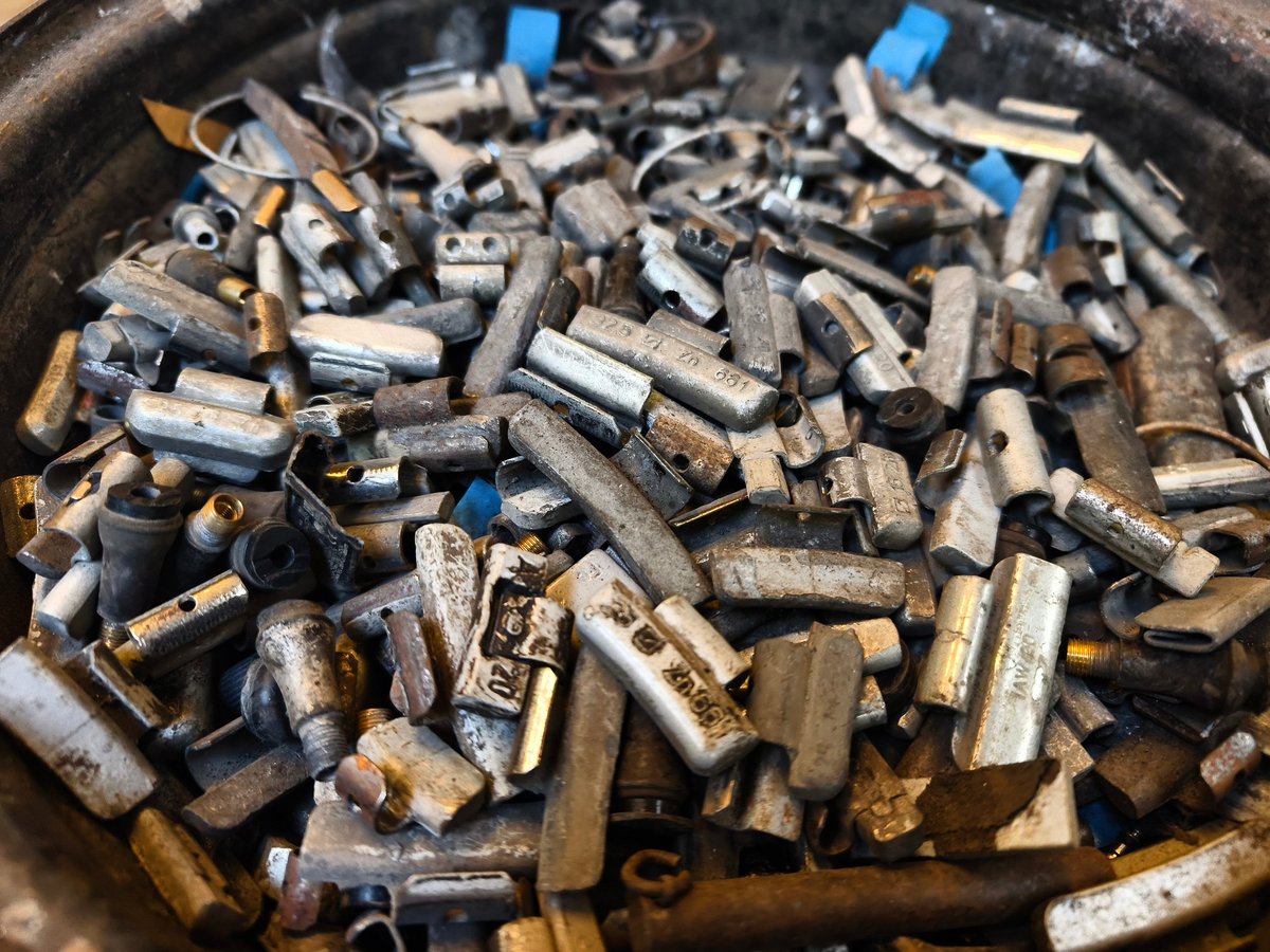 Pile of rusted motor components and gears