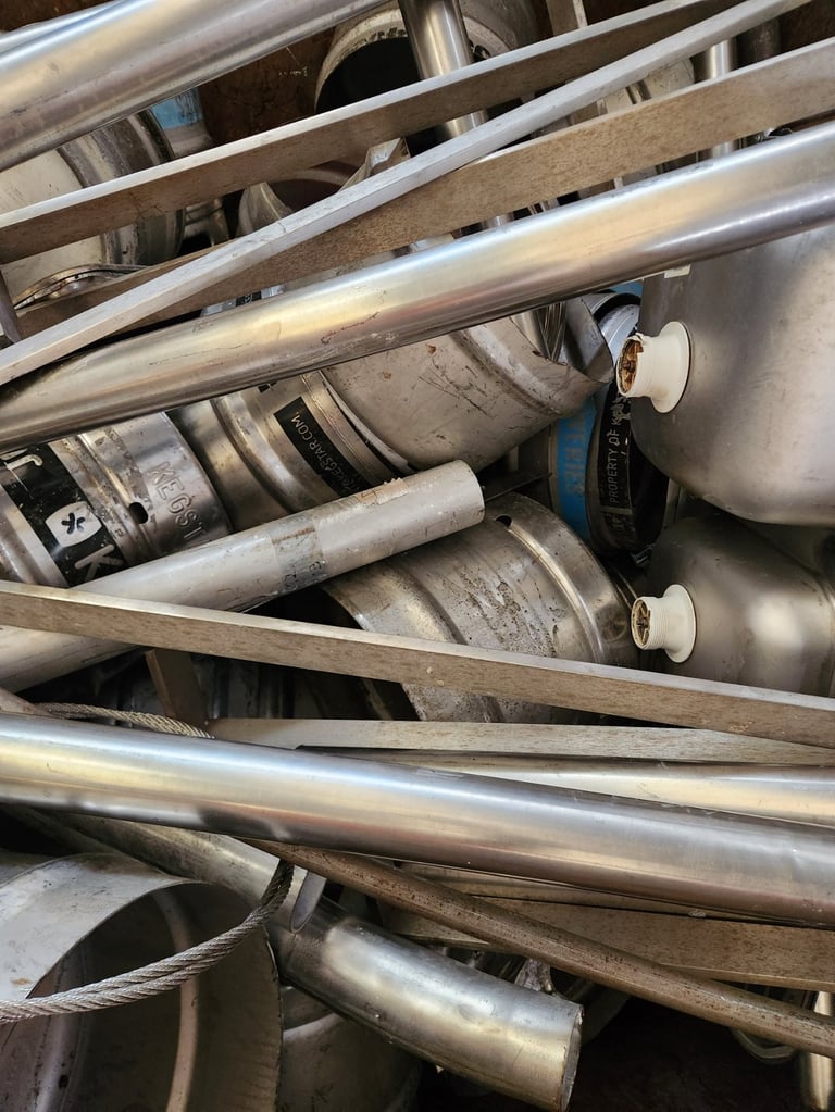 Close-up of vehicle exhaust pipes and muffler components with metal tubing and connectors